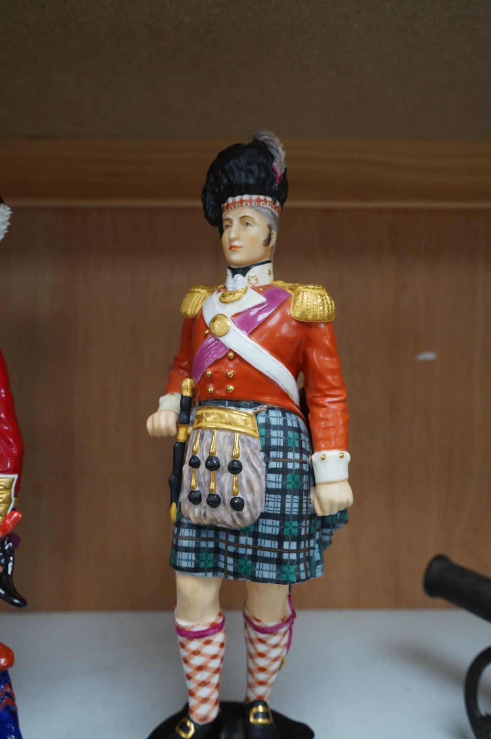 A pair of Sevres style Napoleonic figures and three others including Worcester, tallest 30cm. Condition - fair to good